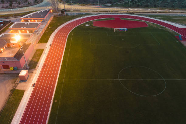 soccer field and running track from above - sports track track and field stadium sport night imagens e fotografias de stock