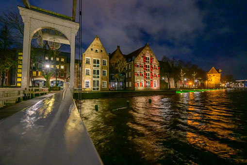 Nighttime view on the Thorbeckegracht in the city center of Zwolle during a dark winter night in Zwolle, Netherlands at the Pelserbrug.