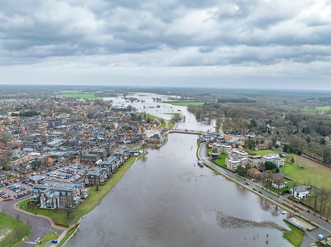High water level in the river Vecht at the in Ommen in the Dutch Vechtdal region in Overijssel, The Netherlands. The river is overflowing on the floodplains after heavy rainfal upstream in The Netherlands and Germany in December 2023.