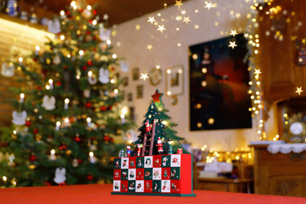 istock Christmas Still Life with Three-dimensional Christmas Tree Advent Calendar in the middle of Christmassy Decorated Family Room 1916856583