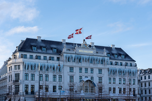 Copenhagen, Denmark - January 04, 2024: Exterior of Hotel d'Angleterre, which is decorated with traditional Christmas decoration