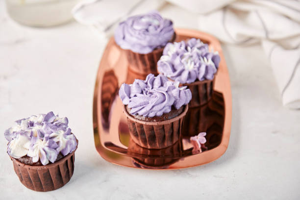 istock Lilac floral cupcakes, aesthetics desserts close up 1916873075
