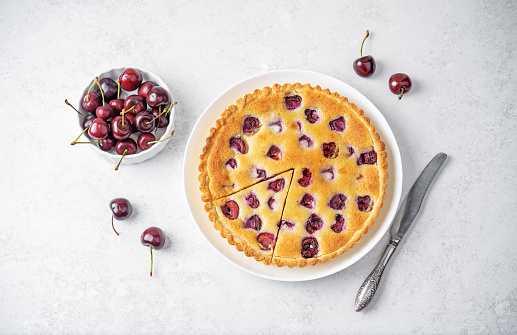 Cherry frangipane cake in a plate. toning