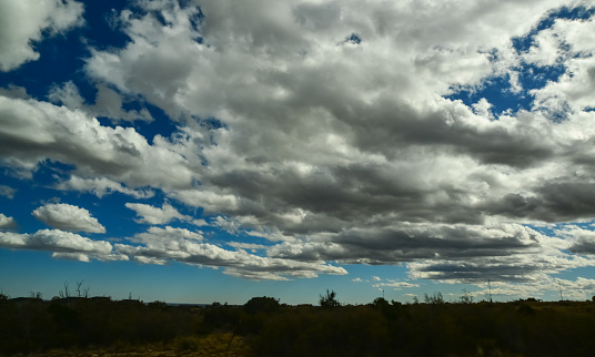Large white clouds over a desert in the state of New Mexico, USA