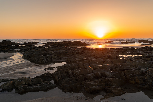 Sunset and seascape with rock formation in at Apulia beach. Parque Natural do Litoral on the north of Portugal in the vicinity of the Esposende town.