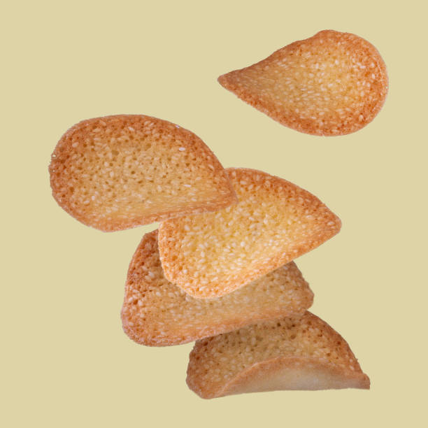 istock sweet crispy sesame cookies, flying food 1916912232