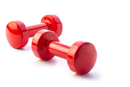 Brightly colored dumbbells  Isolated on a white background. Studio shot.