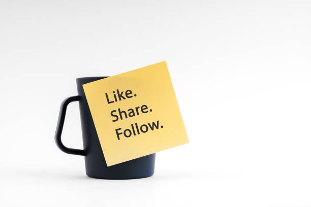 istock Adhesive note with Like Share Follow stick on coffee cup 1916924801
