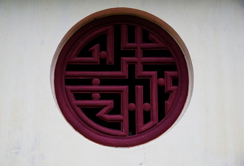 Round window style and decorations in Hue Emperors Citadel, Vietnam
