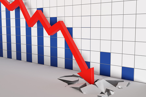 Blue and white tiles forming a bar chart on a wall with a red down arrow cracking the floor in front of them. Illustration of the concept of financial crisis and falling stock prices