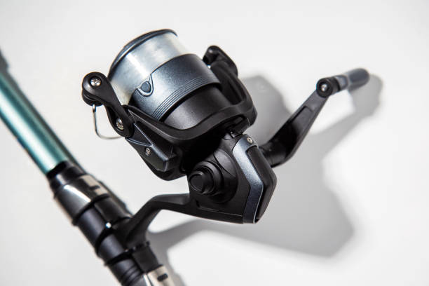 istock Fishing reel for rod close up on a white background isolated. selective focus, copy space 1916936296
