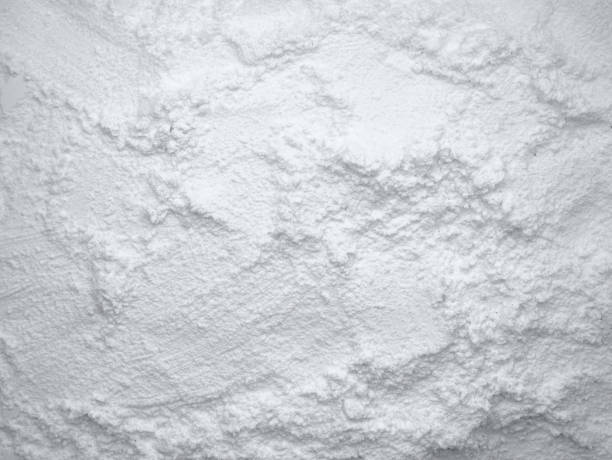 istock White flour texture background. Abstract powder texture. White powder surface with cracks. 1916966987