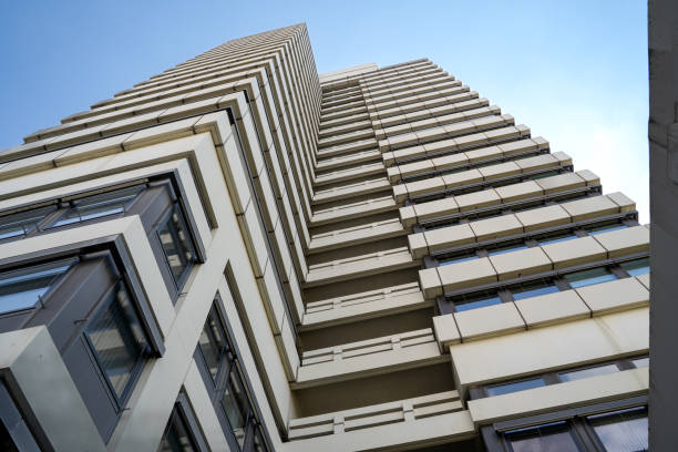 istock Office building with a blue sunny sky in the background 1916971339