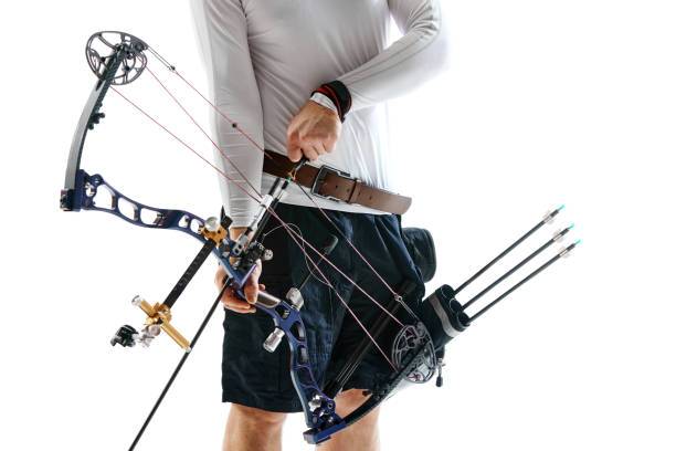 istock Cropped image of man with archery equipment isolated over white studio background. Archery sport, competition 1916986448