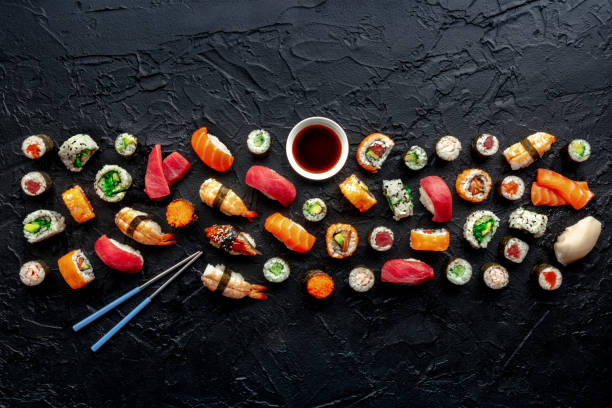 istock Sushi with chopsticks and soy sauce composition with copy space 1916999868