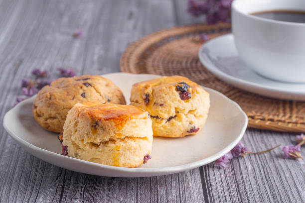 istock Traditional British scones and cookie with a tea cup and blurred background 1917004112