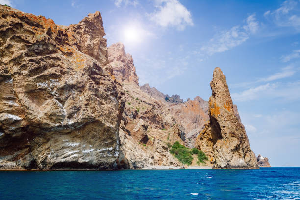 Picturesque mountain range in Crimean peninsula, an ancient extinct volcano. Location Kara Dag (Black Mount), coastal town of Koktebel. Unique place on earth. Explore the world's beauty and wildlife.
