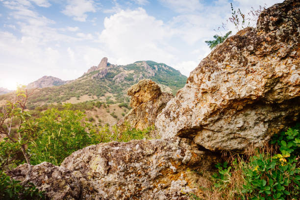 Karadag mountain range in Crimean peninsula, an ancient extinct volcano. Location Kara Dag (Black Mount), coastal town of Koktebel and the Otuzka River valley. Unique place on earth. Beauty world.