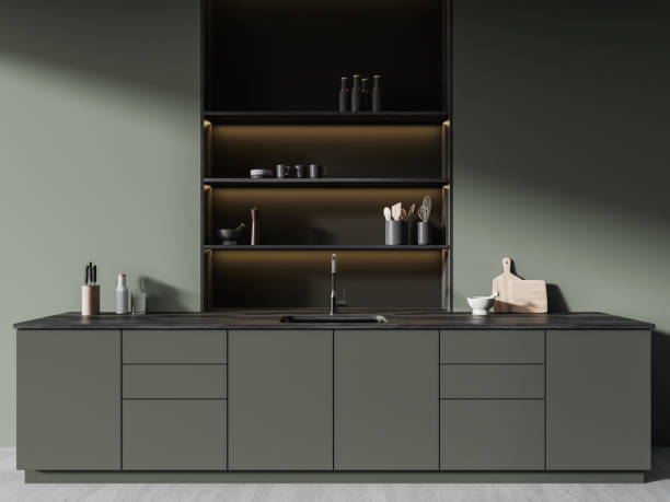 istock Stylish green home kitchen interior with cooking space, shelf with kitchenware 1917009417