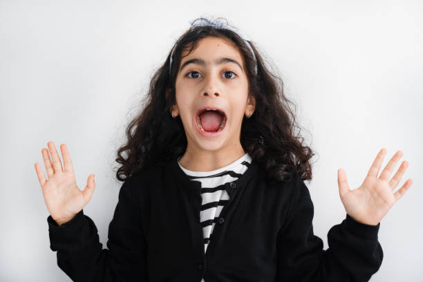 Little Girl with Surprised Look on White
