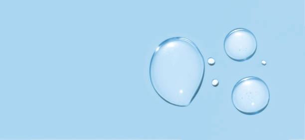 istock drops texture gel serum on blue background closeup 1917015335