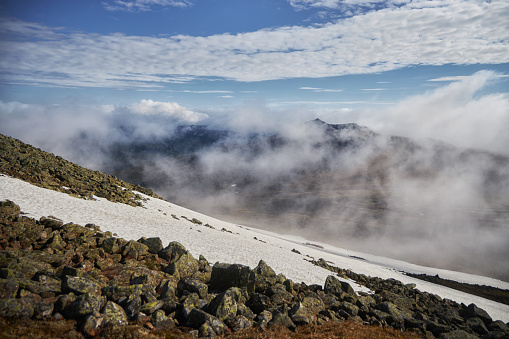 Severe weather in the Ural Mountains, Russia. Fog creeps down the mountainside, cold summer