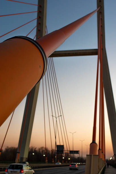 Warsaw, Poland - March 22, 2022: Traffic on the Siekierkowski Bridge in the afternoon, it is a cable-stayed bridge that was built in 2021. Most Siekierkowski is an integral part of the transport and logistics process in Capitol City Warsaw.