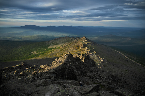 Severe weather in the Ural Mountains, Russia. Fog creeps down the mountainside, cold summer