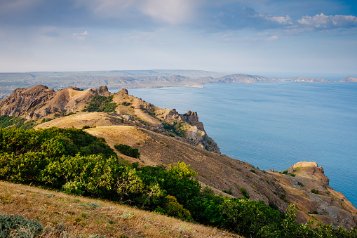 Picturesque mountain range in Crimean peninsula, an ancient extinct volcano. Location Kara Dag (Black Mount), coastal town of Koktebel. Unique place on earth. Explore the world's beauty and wildlife.
