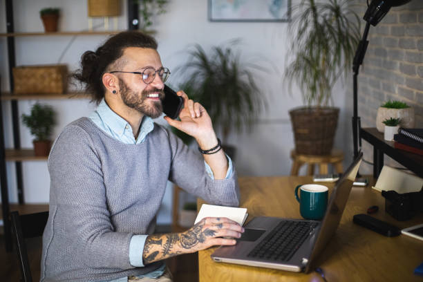 istock Happy businessman having a phone call while working at home office. 1917028795