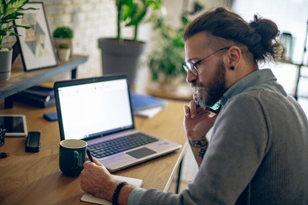 istock Happy businessman having a phone call while working at home office. 1917039110