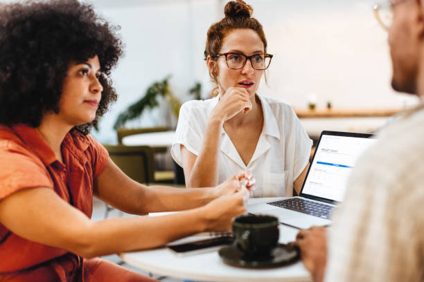 istock Collaborative business team working on a project in a coffee shop 1917046572