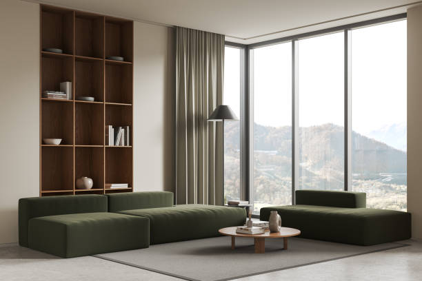 istock Beige home living room interior with couch and shelf, panoramic window 1917048789