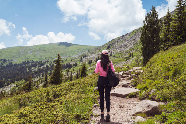 istock Woman  in the summer  mountain 1917056404