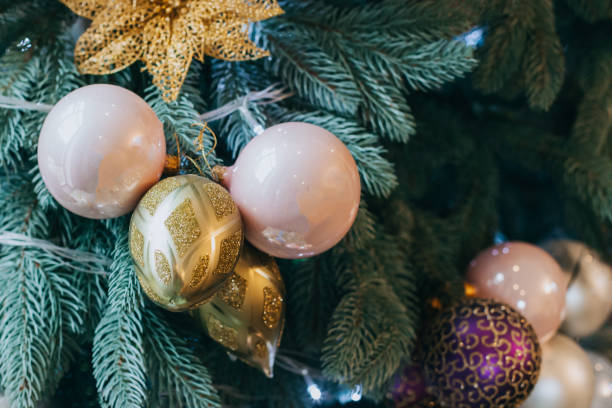 istock Spruce branches with Christmas ornaments and lights. 1917058094