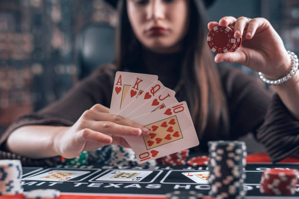 istock Young female player make bet, raise chips in poker game, change to win 1917059854