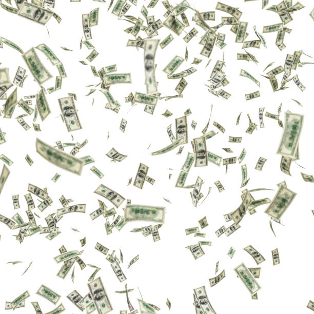 istock dollar banknote fall from the sky isolated on white. 1917072297