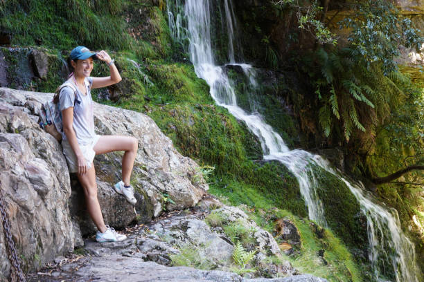 istock Beautiful Woman and Waterfall 1917084524