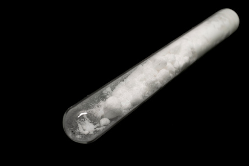 glass vial with white powder
