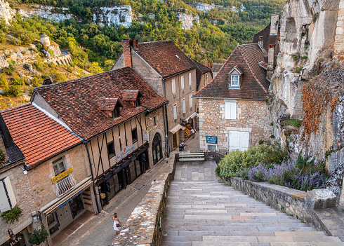Rocamadour, France - December 9, 2017: View from historic village and castle Rocamadour on the bank of the valley Dordogne in southern France at winter. Main street with shops, cafe and restaurants in Rocamadour.