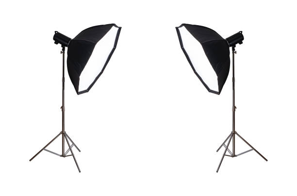 Softbox with flash on tripod stand isolated on white background.