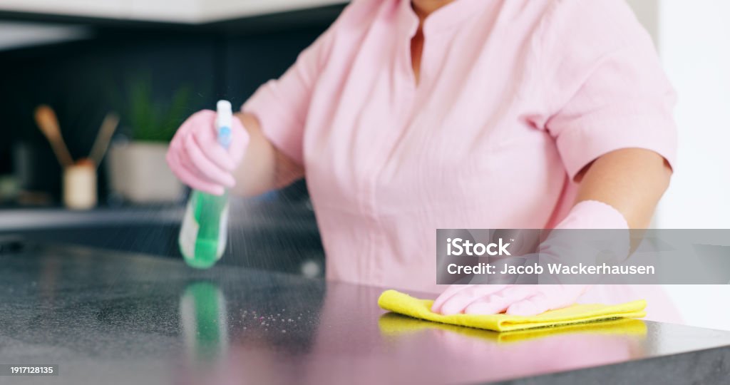 Cleaning, woman or spray on kitchen counter with detergent, housekeeper or service for home hygiene. Hands, person and cloth in housekeeping to shine, sanitizer and disinfectant for surface in house - Royalty-free 50-54 Yaşlar Arası Stok görsel Cleaning, woman or spray on kitchen counter with detergent, housekeeper or service for home hygiene. Hands, person and cloth in housekeeping to shine, sanitizer and disinfectant for surface in house - Royalty-free 50-54 Yaşlar Arası Stok görsel