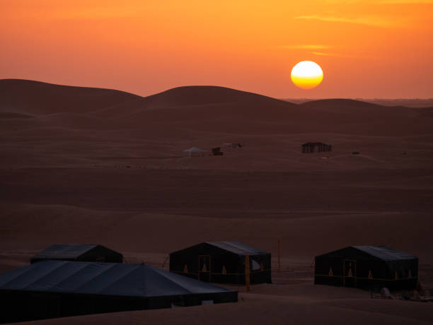 istock Sun setting over a desert camp in Zagora province, Morocco 1917130946