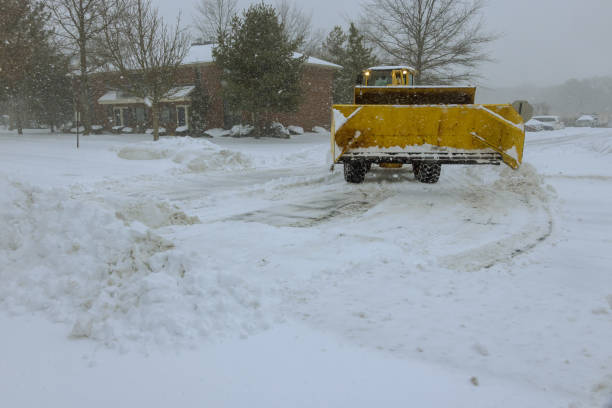 istock During winter, a tractor removes snow from a road after it has fallen 1917137378