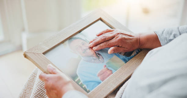 Senior woman, grief and picture of husband on lap, hands and sad of love loss in retirement. Elderly person, alone and dear memory of beloved with anxiety, mental health and lonely bereaved in house Senior woman, grief and picture of husband on lap, hands and sad of love loss in retirement. Elderly person, alone and dear memory of beloved with anxiety, mental health and lonely bereaved in house loss of a loved one stock pictures, royalty-free photos & images Senior woman, grief and picture of husband on lap, hands and sad of love loss in retirement. Elderly person, alone and dear memory of beloved with anxiety, mental health and lonely bereaved in house Senior woman, grief and picture of husband on lap, hands and sad of love loss in retirement. Elderly person, alone and dear memory of beloved with anxiety, mental health and lonely bereaved in house loss of a loved one stock pictures, royalty-free photos & images