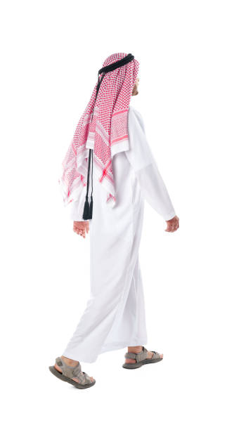 istock Back view of an Arab man in thobe standing on white isolated background 1917155507
