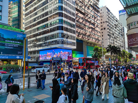 Hong Kong, December 24, 2023 : Crowds of people in the Tsim Sha Tsui area, Hong Kong.