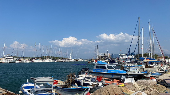 Urla, Izmir, Turkey 10, Sept,2023 : Small port of Urla with fishing and touristic daily boat tour yatchings. Urla is popular tourist attraction in Seferihisar, Izmir, Turkey.