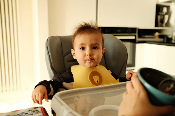 istock A cute baby is eating for lunch 1917188318
