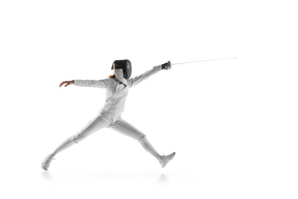istock Skilled swordswoman executes precise parry against white studio background. Essence of strategy and athleticism. 1917191065